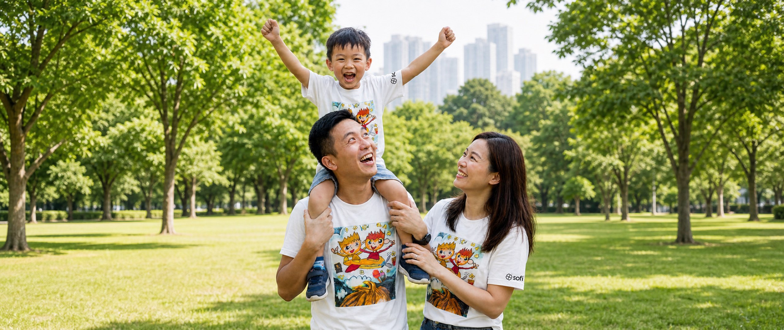 Family wearing kids artwork shirts in the park